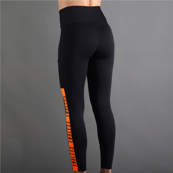 LEGGINGS SYNCRO - NOIR ORANGE